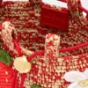 Bolsita con cordón «Strawberry» en piel de becerro clásica y rafia Bolsita con cordón «Strawberry» en piel de becerro clásica y rafia