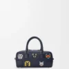 Bolso corto Cats Amazona 23 en mezclilla bordada Bolso corto Cats Amazona 23 en mezclilla bordada
