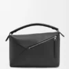 Bolso Puzzle Edge grande en piel de becerro granulada Bolso Puzzle Edge grande en piel de becerro granulada