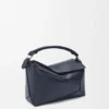 Bolso Puzzle Edge pequeño en piel de becerro de grano suave Bolso Puzzle Edge pequeño en piel de becerro de grano suave