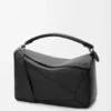 Bolso Puzzle grande en piel de becerro granulada y flexible Bolso Puzzle grande en piel de becerro granulada y flexible