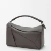 Bolso Puzzle grande en piel de becerro granulada y flexible Bolso Puzzle grande en piel de becerro granulada y flexible