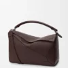 Bolso Puzzle grande en piel de becerro granulada y flexible Bolso Puzzle grande en piel de becerro granulada y flexible