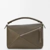 Bolso Puzzle grande en piel de becerro granulada y flexible Bolso Puzzle grande en piel de becerro granulada y flexible