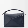 Bolso Puzzle grande en piel de becerro granulada y flexible Bolso Puzzle grande en piel de becerro granulada y flexible