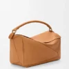Bolso Puzzle grande en piel de becerro granulada y flexible Bolso Puzzle grande en piel de becerro granulada y flexible
