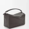 Bolso Puzzle grande en piel de becerro granulada y flexible Bolso Puzzle grande en piel de becerro granulada y flexible