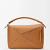 Bolso Puzzle grande en piel de becerro granulada y flexible Bolso Puzzle grande en piel de becerro granulada y flexible