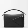 Bolso Puzzle grande en piel de becerro granulada y flexible Bolso Puzzle grande en piel de becerro granulada y flexible
