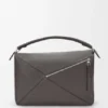 Bolso Puzzle grande en piel de becerro granulada y flexible Bolso Puzzle grande en piel de becerro granulada y flexible
