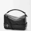 Bolso Puzzle grande estilo motero en piel de becerro brillante Bolso Puzzle grande estilo motero en piel de becerro brillante