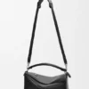 Bolso Puzzle grande estilo motero en piel de becerro brillante Bolso Puzzle grande estilo motero en piel de becerro brillante