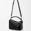 Bolso Puzzle pequeño en piel de becerro clásica y gamuza Bolso Puzzle pequeño en piel de becerro clásica y gamuza