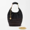 Bolso Squeeze pequeño en piel de becerro napa tejida