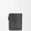 Cartera compacta y delgada Puzzle en piel de becerro clásica Cartera compacta y delgada Puzzle en piel de becerro clásica