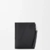 Cartera delgada y compacta Puzzle en piel de becerro granulada y flexible Cartera delgada y compacta Puzzle en piel de becerro granulada y flexible