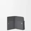 Cartera delgada y compacta Puzzle en piel de becerro granulada y flexible