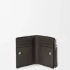 Cartera delgada y compacta Puzzle en piel de becerro granulada y flexible