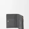 Cartera delgada y compacta Puzzle en piel de becerro granulada y flexible
