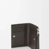 Cartera delgada y compacta Puzzle en piel de becerro granulada y flexible