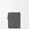 Cartera delgada y compacta Puzzle en piel de becerro granulada y flexible