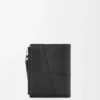 Cartera delgada y compacta Puzzle en piel de becerro granulada y flexible Cartera delgada y compacta Puzzle en piel de becerro granulada y flexible