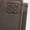 Cartera doble «Puzzle» en piel de becerro clásica Cartera doble «Puzzle» en piel de becerro clásica
