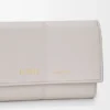Cartera vertical pequeña en piel de becerro lisa y granulada Cartera vertical pequeña en piel de becerro lisa y granulada