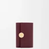 Cartera vertical pequeña «Pebble» en piel de becerro napa brillante