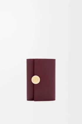 Cartera vertical pequeña «Pebble» en piel de becerro napa brillante Cartera vertical pequeña «Pebble» en piel de becerro napa brillante