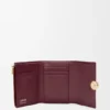 Cartera vertical pequeña «Pebble» en piel de becerro napa brillante