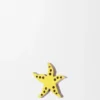 Dado con forma de estrella de mar en piel de becerro Dado con forma de estrella de mar en piel de becerro