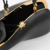 Minaudière «Twist» en piel de cordero napa