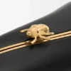 Minaudière «Twist» en piel de cordero napa