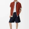 Pantalones cortos plisados de algodón y lino