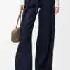 Pantalones de mezclilla con cinturón Pantalones de mezclilla con cinturón